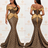 Robe sirène noire et dorée en brocard