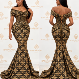 Robe sirène noire et dorée en brocard